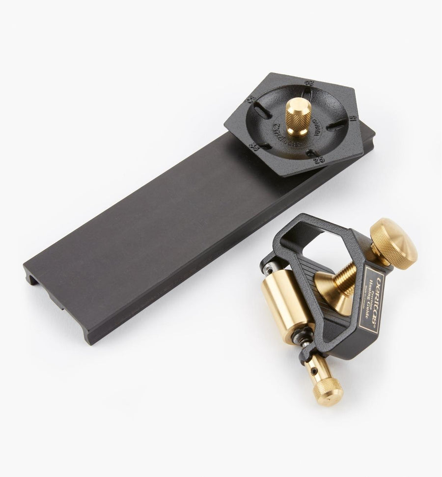 The Veritas Sharpening System by Ver, featuring a black and brass precision honing guide with an adjustable clamp and knob plus a flat black angle setting base for creating micro bevels, is showcased against a plain background.