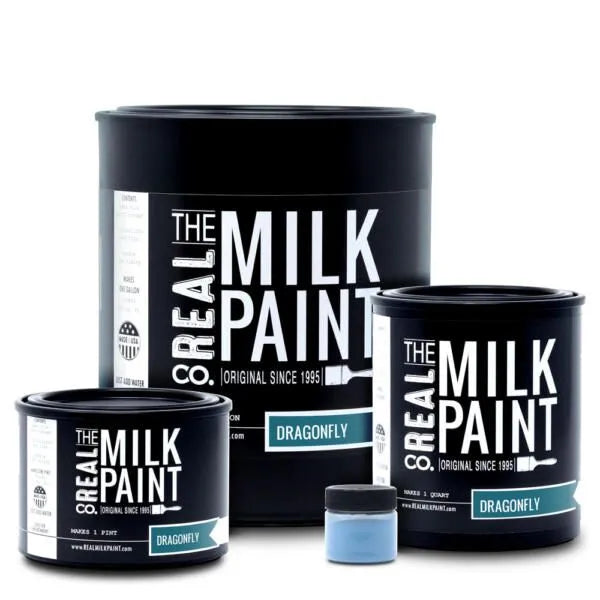 Three cans of RMP’s Milk Paint in Dragonfly color, including two large 128 oz gallons and one small jar of organic pigments, providing a nontoxic and biodegradable paint solution.