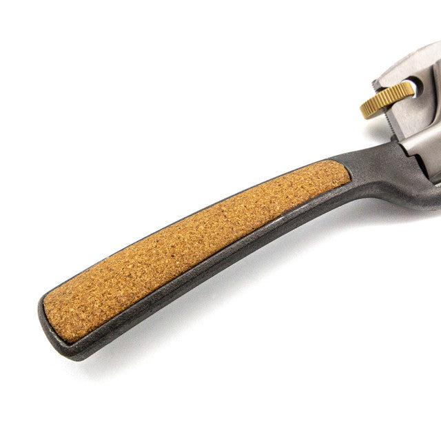 Close-up of the Melbourne Tool Company Spokeshave with a black handle and cork grip, expertly crafted for woodworking enthusiasts.