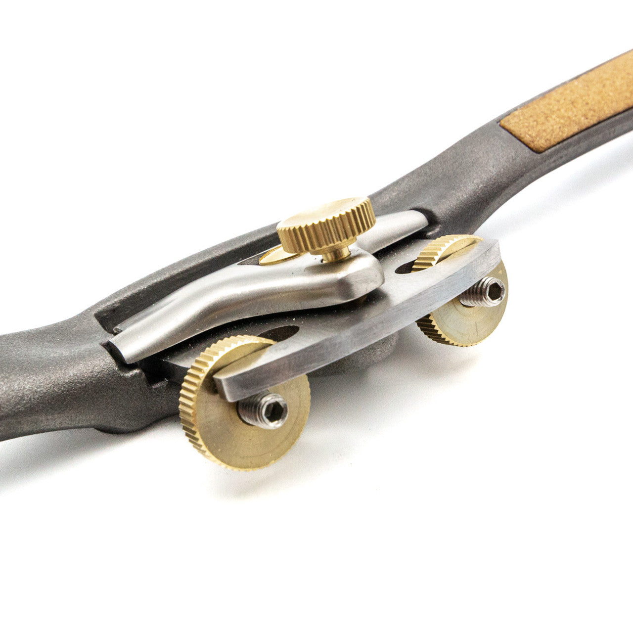 Close-up of the Melbourne Tool Company's adjustable spokeshave, featuring brass knobs and a sharp steel blade, ideal for woodworking tasks.