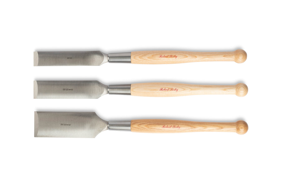 Three Robert Sorby Timber Framing Slick chisels by SOR, featuring Sheffield Steel blades and rounded wooden handles, are aligned horizontally against a white background, reflecting precision and quality.