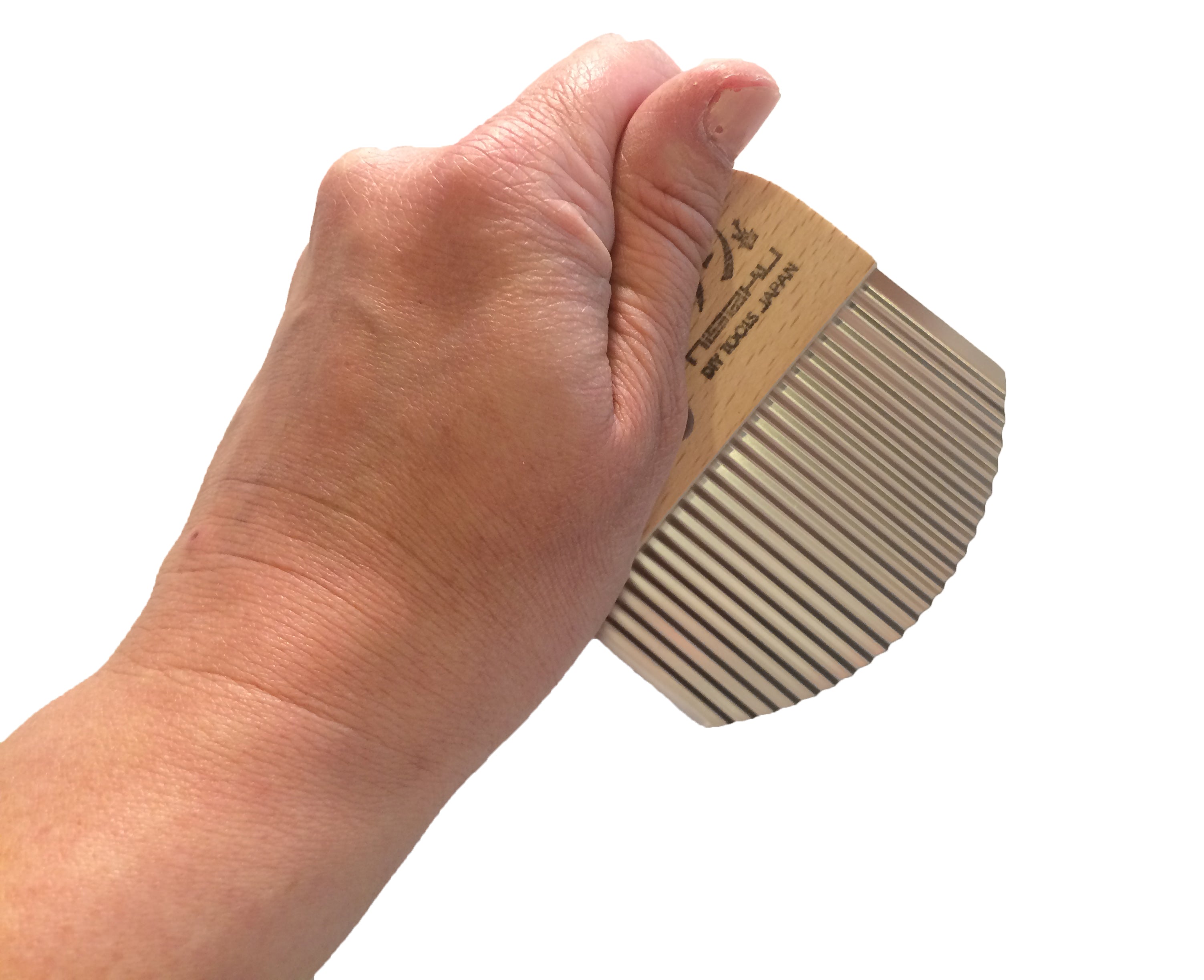 A hand grips the MARU Weed Slicer, which features a sturdy wooden handle and a corrugated blade ideal for precise food slicing.