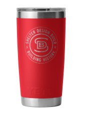 The Shelter Yeti Rambler Tumbler, featuring a silver rim and base with the "Shelter Design Build" logo etched in white, offers double-wall vacuum insulation to maintain drink temperature. Its MagSlide lid adds convenience for active lifestyles.