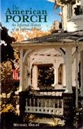 Cover of a book titled "The American Porch (Hardcover)" by Michael Dolan, published by The Lyons Press, showcasing an image of an American porch with a white railing and an American flag in the background. This book beautifully blends architectural history with cultural insights.