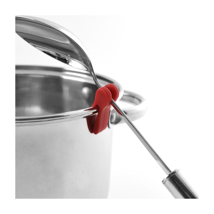 The NORP Grip-Ez Pot Clip, made of heat-resistant silicone, secures a metal spoon on a stainless steel pots edge with the lid resting on top, keeping your cooking organized and efficient.